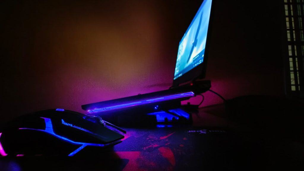 a computer desk with a mouse and a monitor
